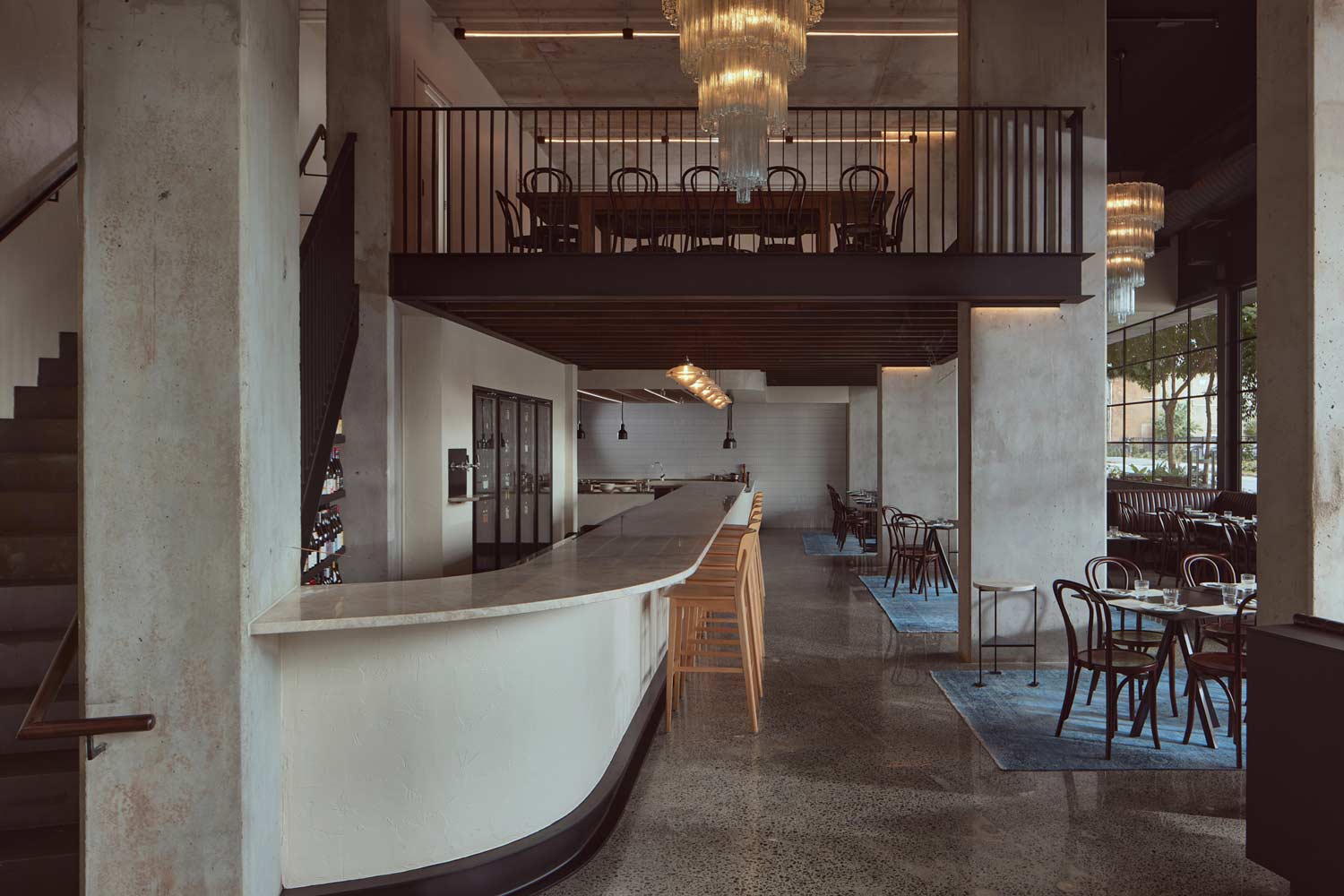 The two levels of Petite, with the mezzanine private dining table above the granite bar and main dining room